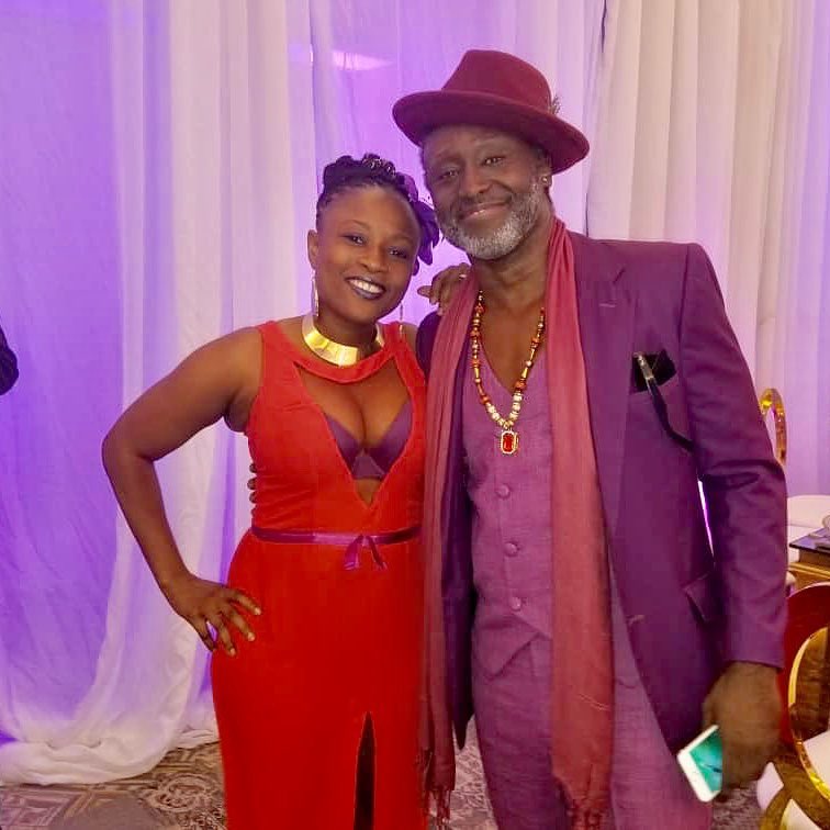 Reggie Rockstone with wife at Sarkodie and Tracy's white wedding held at Labadi Beach Hotel in Accra on Saturday, July 21.