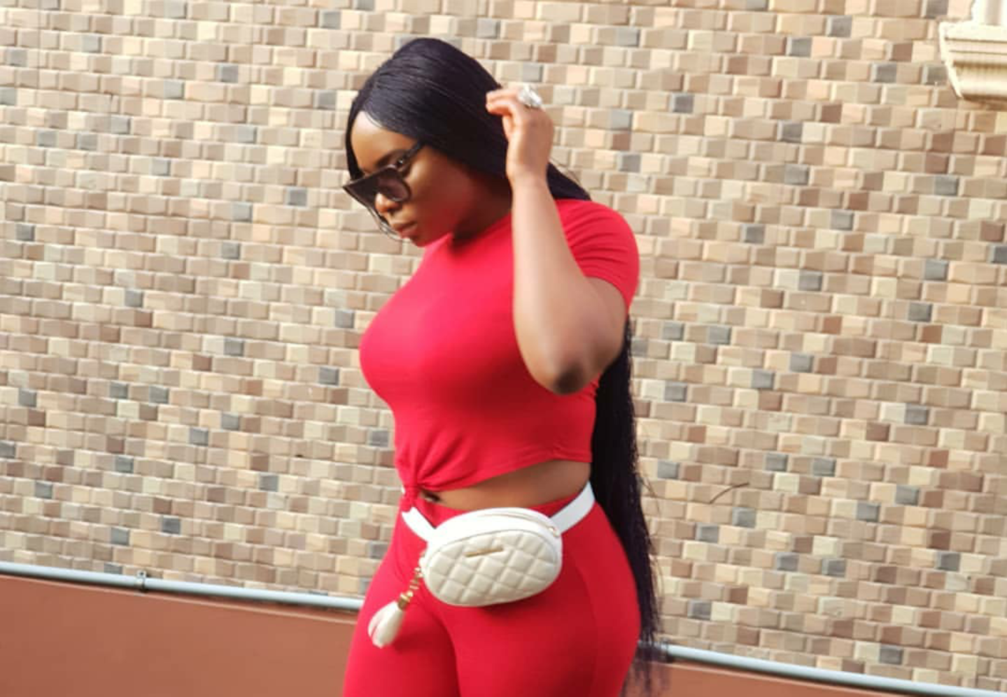 Yemi Alade served slay goals in two-piece pants and top styled with a fanny pack and plain mule