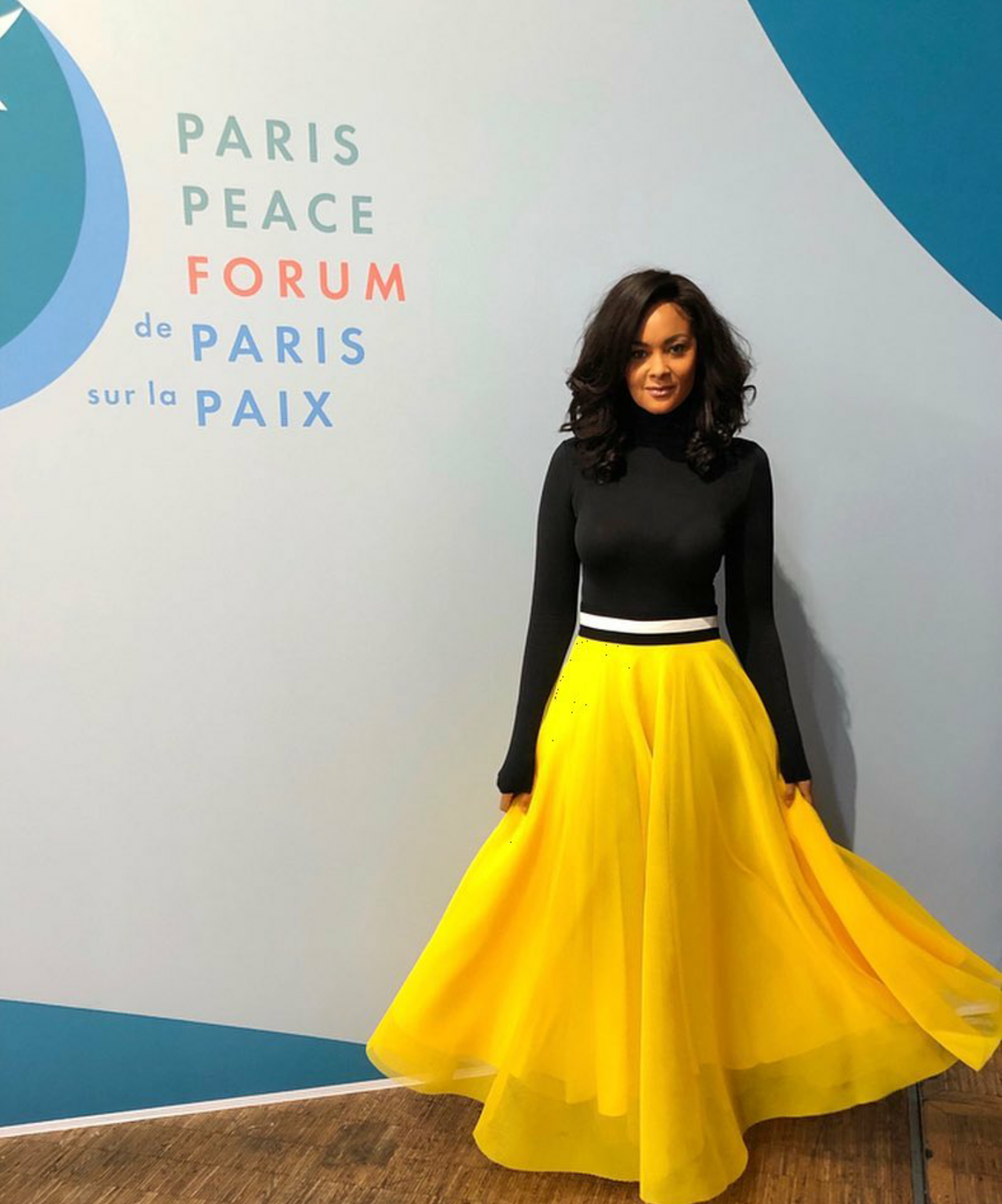 Menaye Donkor is so slay goals in this long sleeved-turtle neck top and flared skirt 