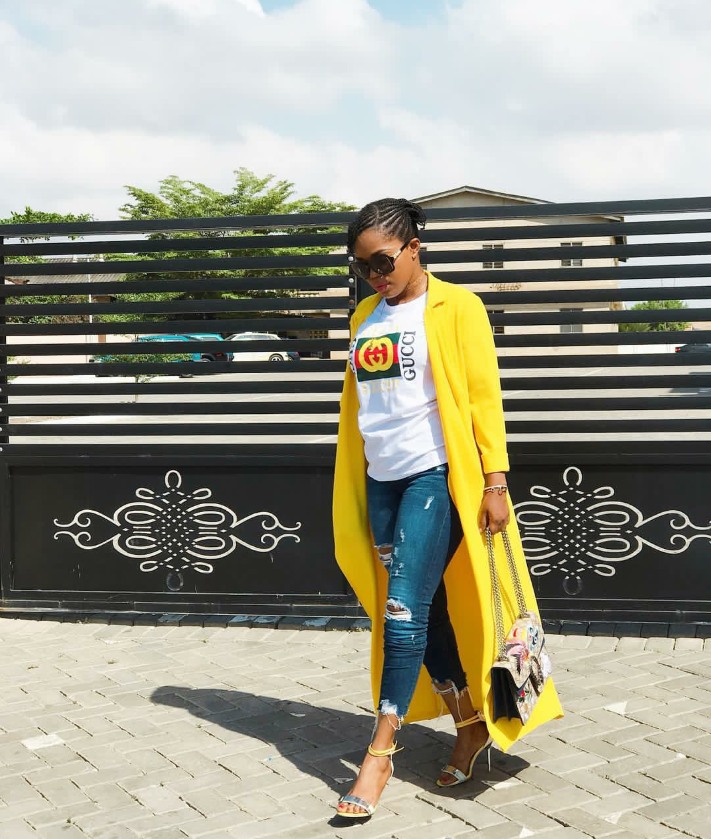 Mzbel served a look in this Gucci tee over denim and a long coat 