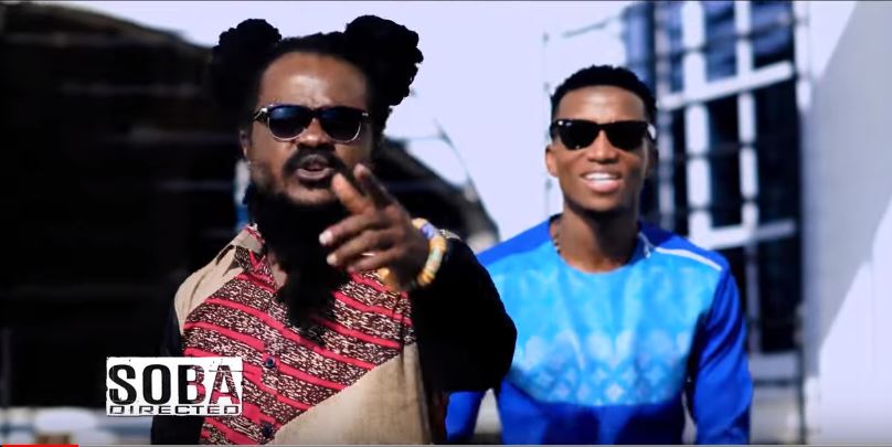 Ras Kuuku and Kofi Kinaata in Wo Remix video