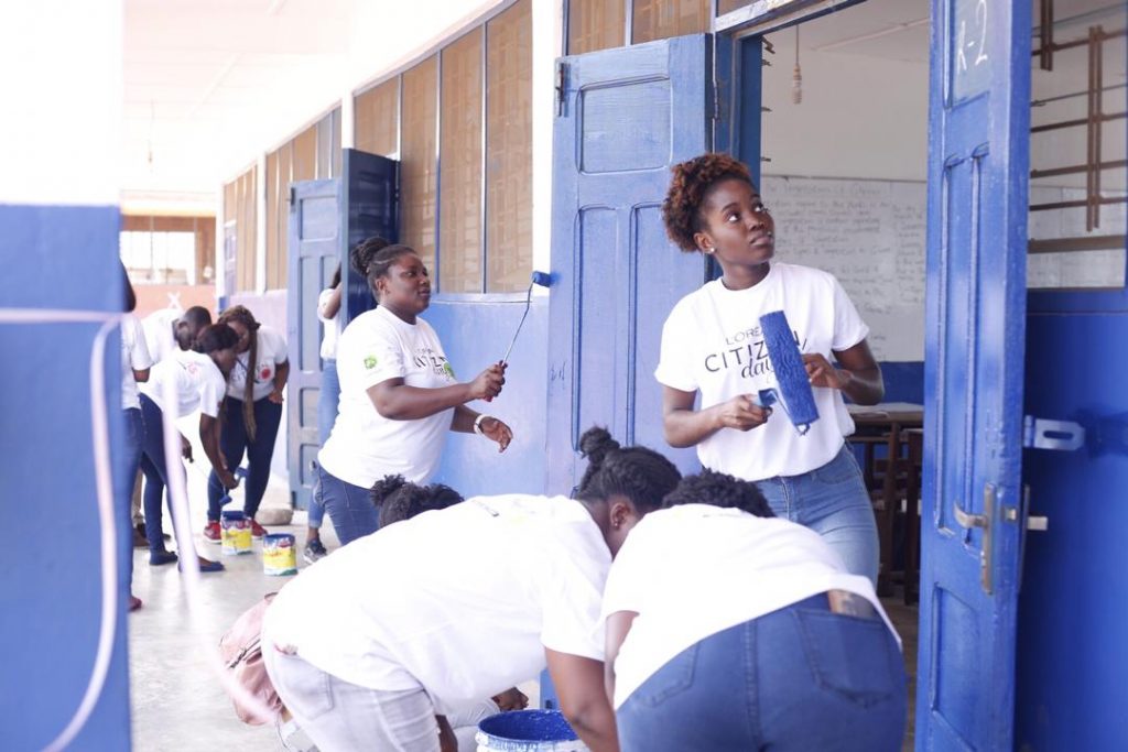 Staff of LOreal West Africa painting the school premises