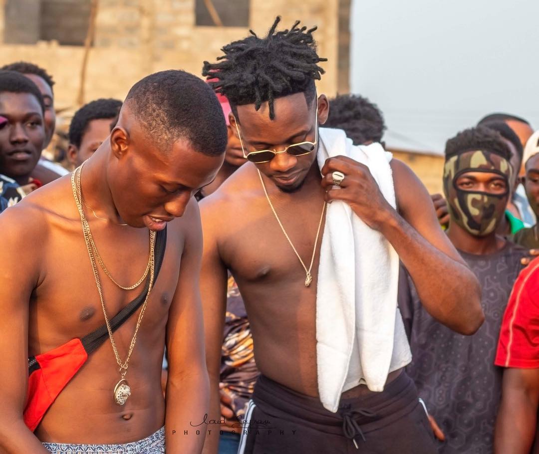 J.Derobie and Mr Eazi in Poverty music video
