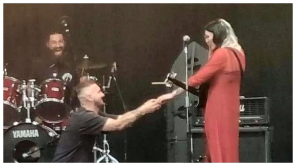 A music festival sees a guitarist propose to his bandmates fiancee